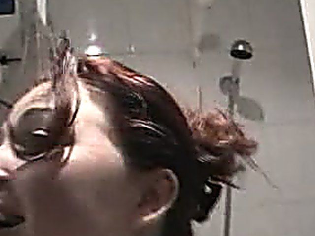 Hot brunette gets kinky in the shower