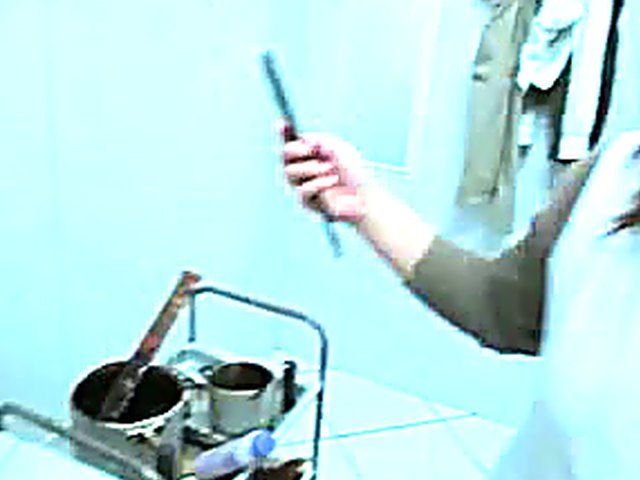 Naked woman gets her beautiful pussy trimmed