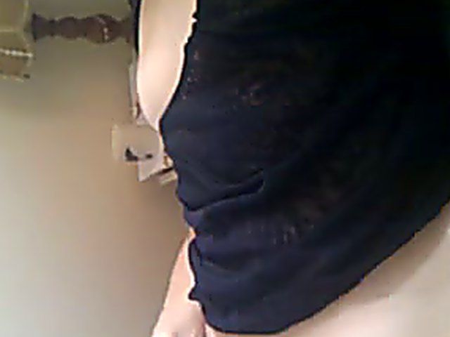 Horny babe fingers and rubs her hairy pussy