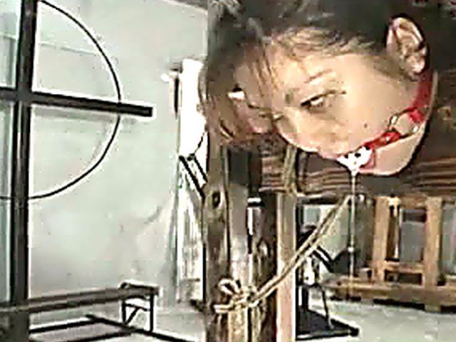 Tied up Japanese babe gets a hard spanking