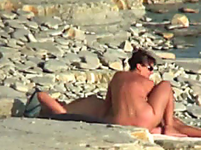 Wife gives a blow job on the beach
