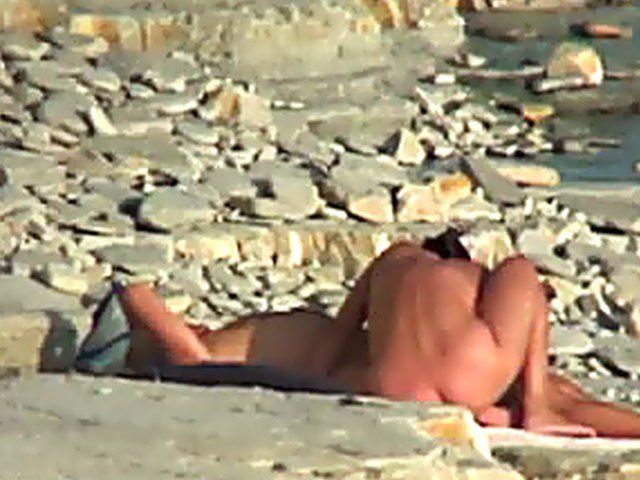 Wife gives a blow job on the beach