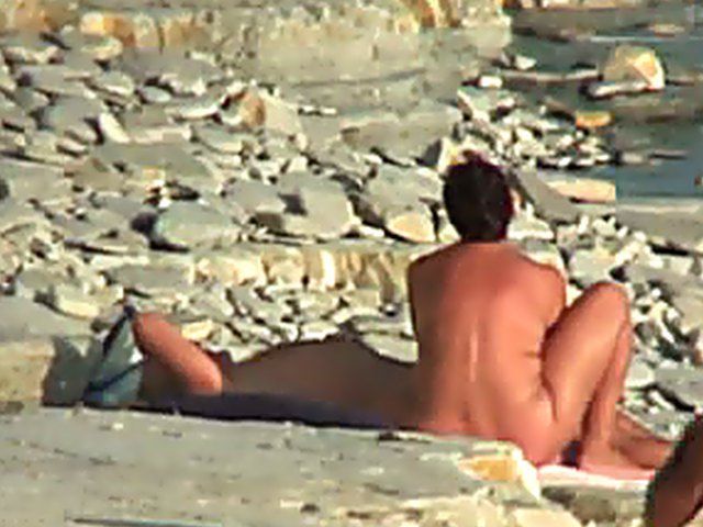 Wife gives a blow job on the beach