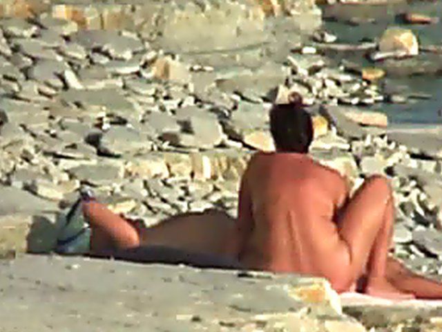 Wife gives a blow job on the beach