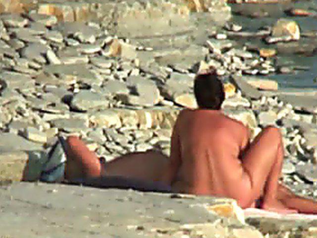 Wife gives a blow job on the beach