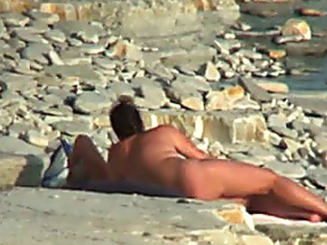 Wife gives a blow job on the beach