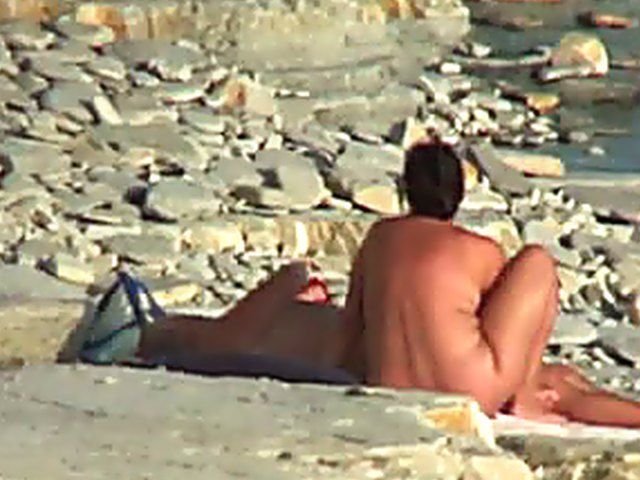 Wife gives a blow job on the beach