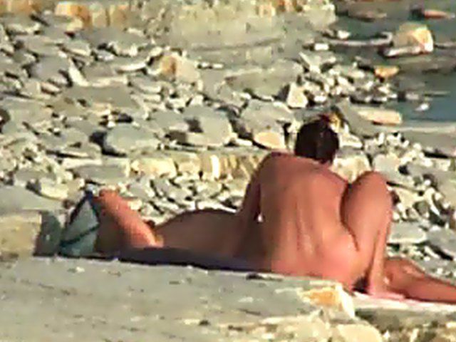 Wife gives a blow job on the beach