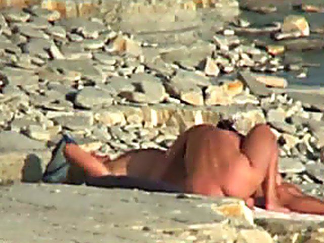 Wife gives a blow job on the beach