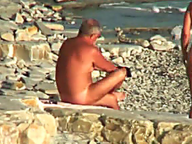 Wife gives a blow job on the beach