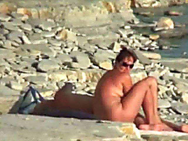 Wife gives a blow job on the beach