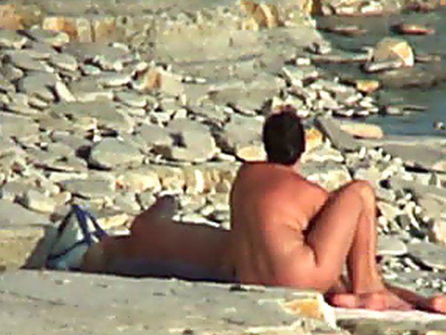 Wife gives a blow job on the beach