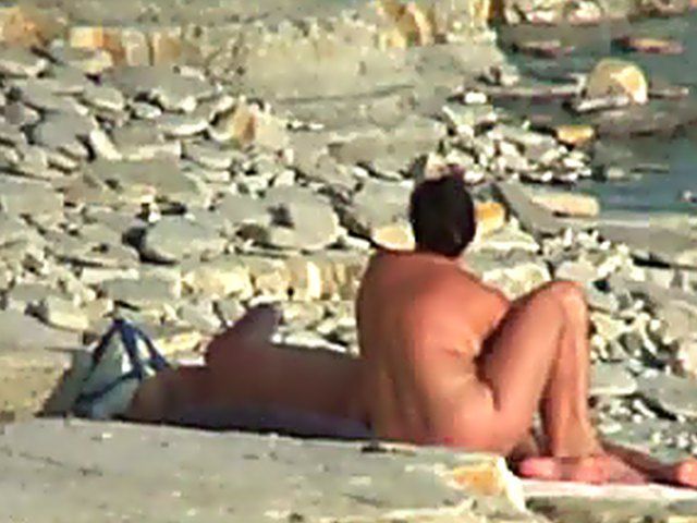 Wife gives a blow job on the beach