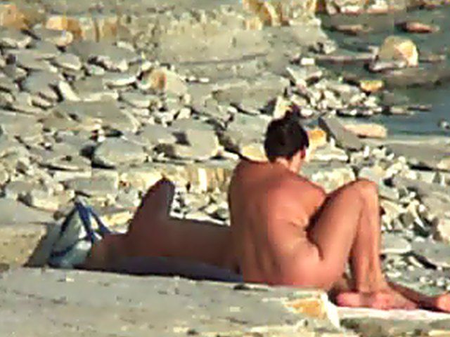 Wife gives a blow job on the beach