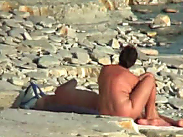 Wife gives a blow job on the beach