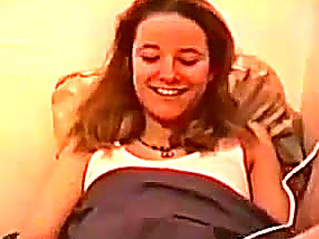 Brunette stays home and plays with her toys