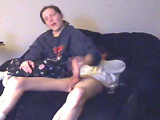 A good looking housewife jerks her husbands cock