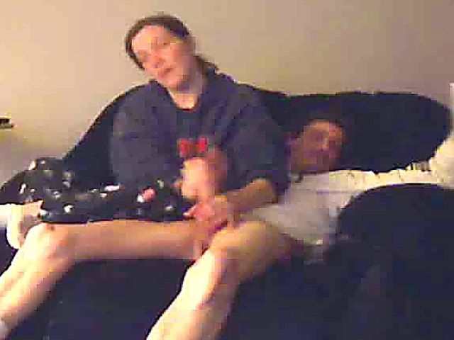 A good looking housewife jerks her husbands cock