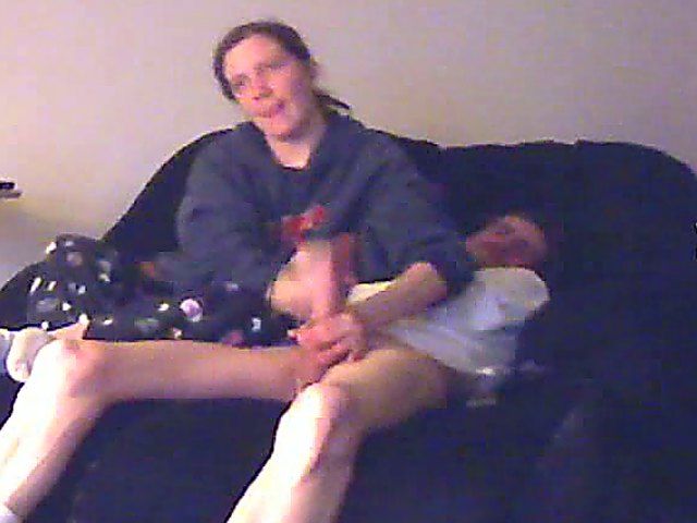 A good looking housewife jerks her husbands cock