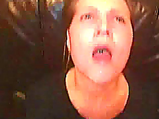 Sexy babe in bondage gets a facial