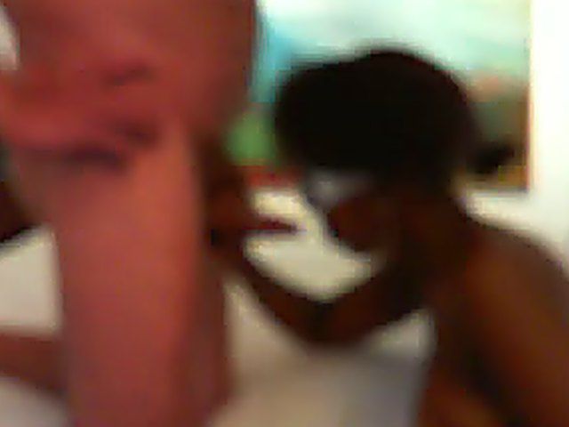 Busty black brunette sucks on an old cock