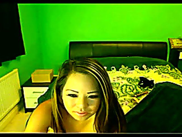 Gorgeous Asian chick plays with a dildo