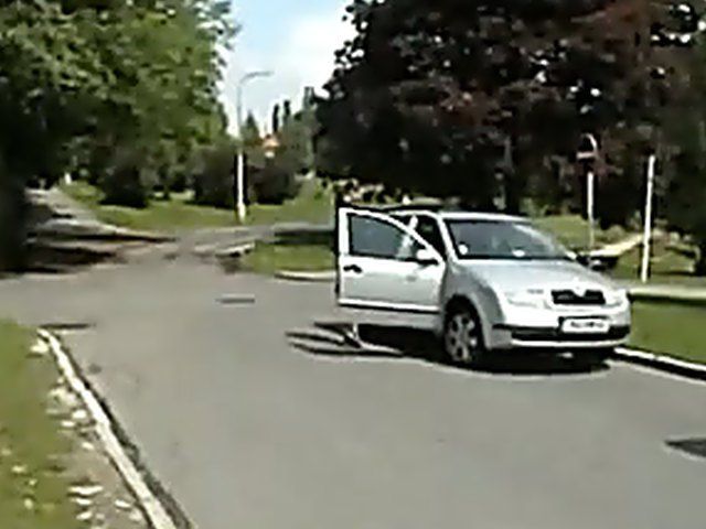 Sexy brunette walks the streets with nothing on