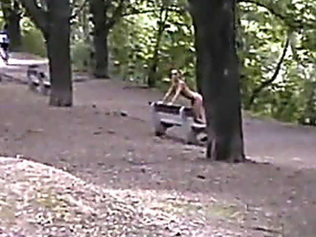 Sexy brunette walks the streets with nothing on