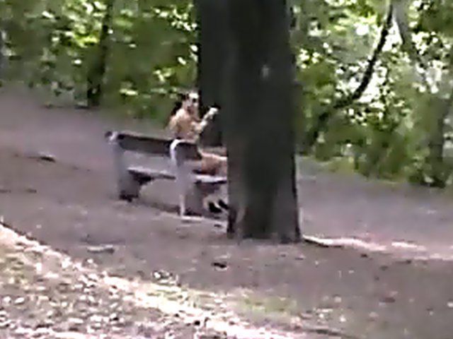 Sexy brunette walks the streets with nothing on