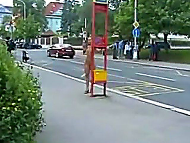 Sexy brunette walks the streets with nothing on