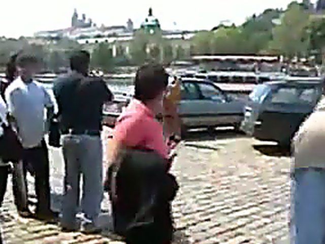 Sexy brunette walks the streets with nothing on