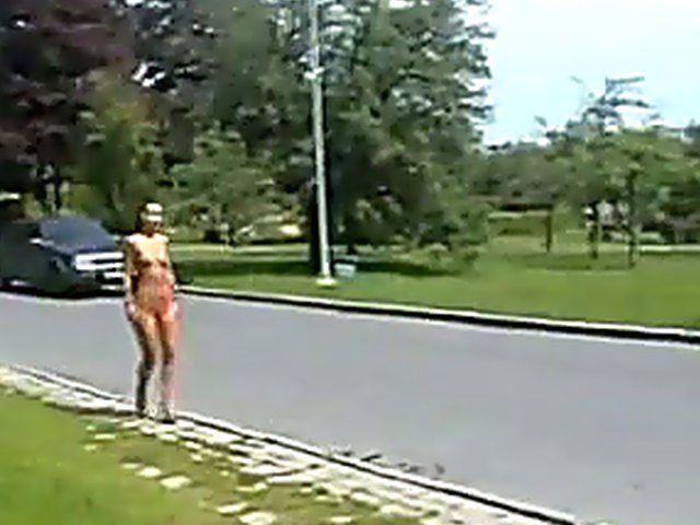 Sexy brunette walks the streets with nothing on