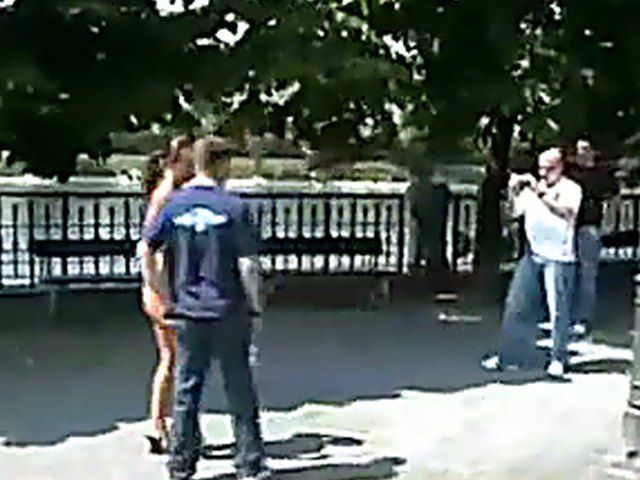 Sexy brunette walks the streets with nothing on