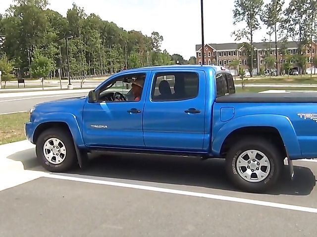 Big boobed cowgirl in a car