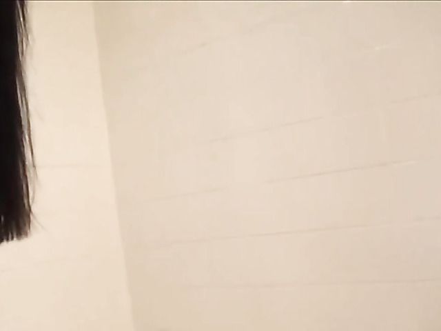Sexy teen brunette under the shower