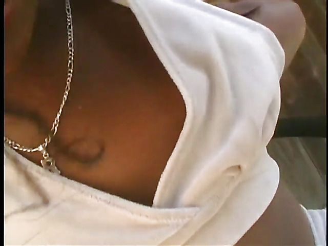 Ebony chick plays with her pink hole