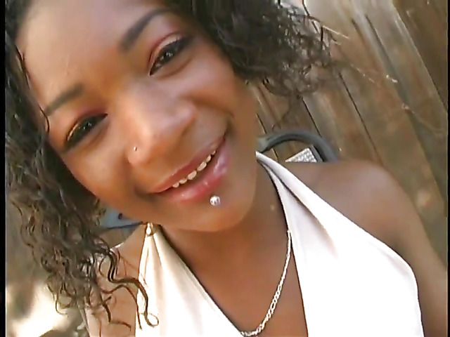 Ebony chick plays with her pink hole