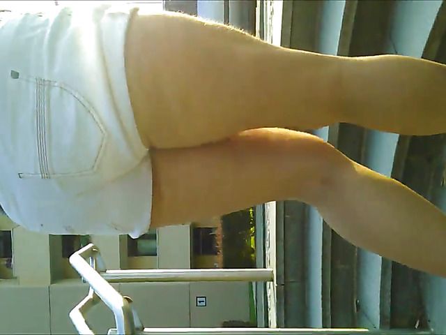 Big ass woman in shorts bares her knockers