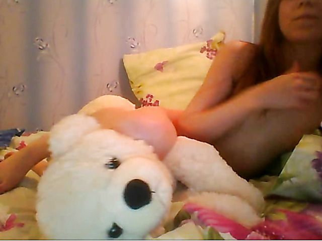 Nude cute redhead and in bed with teddy bear