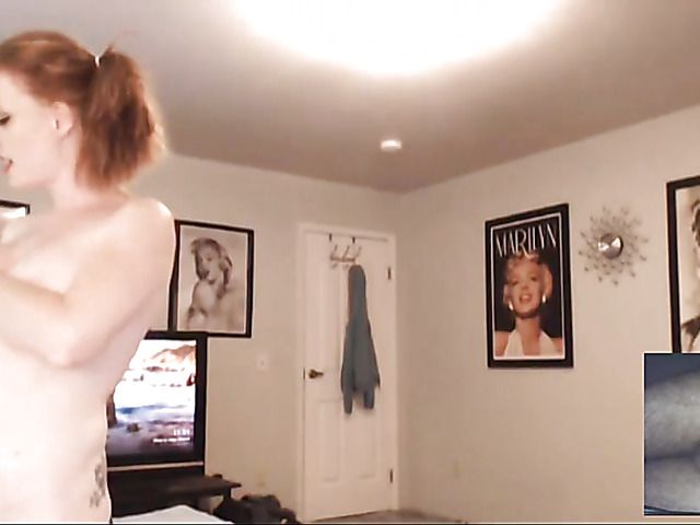 Redhead with big tits poses in black panties on webcam