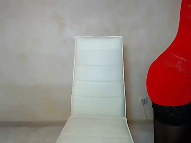 Busty webcam model Barrrbi in red and black