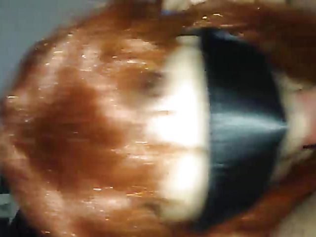Redhead wife has oral sex with a mask
