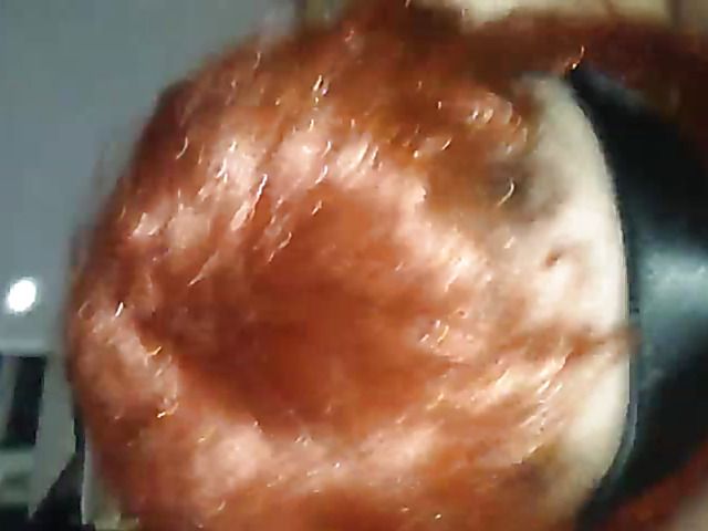 Redhead wife has oral sex with a mask