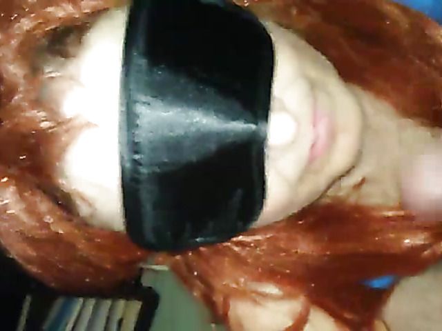Redhead wife has oral sex with a mask
