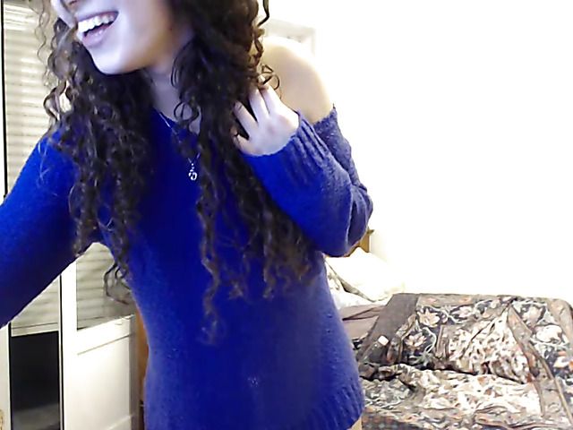 Curly haired girl fucks her holes with vibrator on webcam