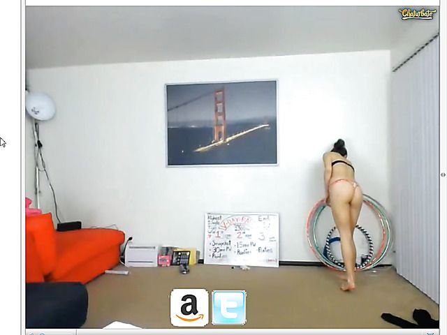 Sexy girl with a hula hoop posing in revealing panties
