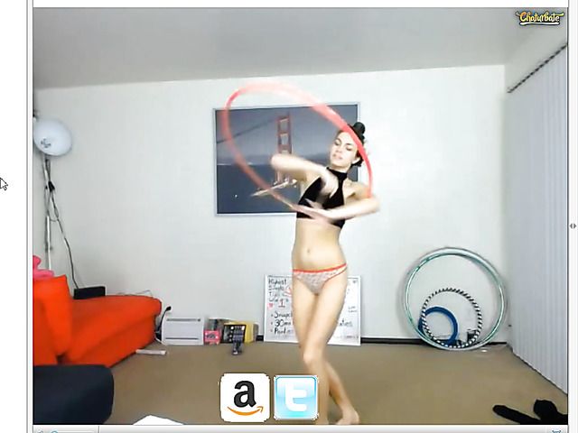 Sexy girl with a hula hoop posing in revealing panties