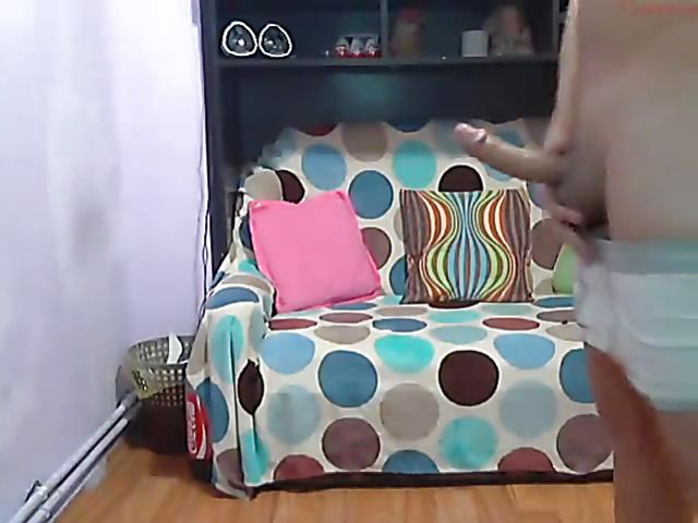 Redhead cam girl polishing a cock with her lips