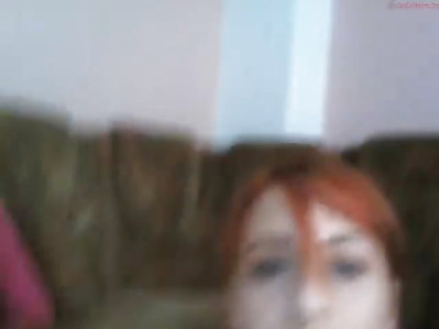 Naughty girl posing in shorts and giving webcam blowjob