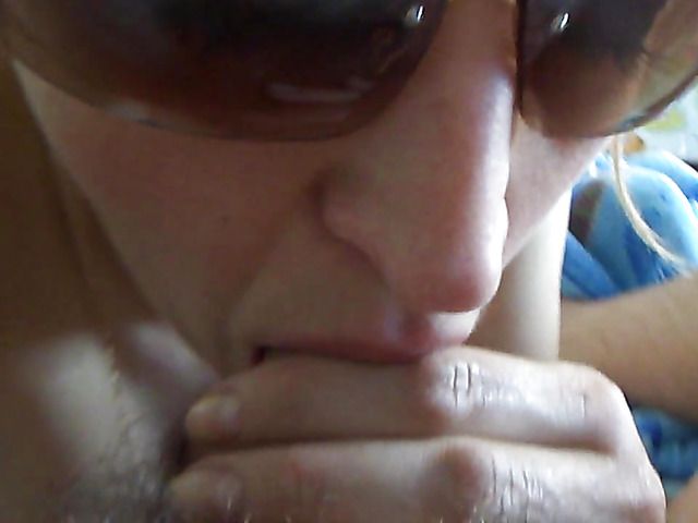 Wife in sunglasses gives blowjob to her hairy husband